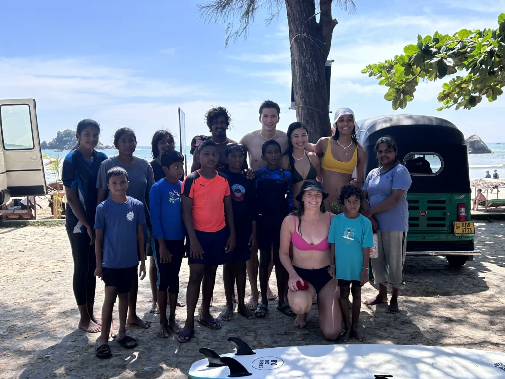 Kids learning surfing through Viji Surf community project